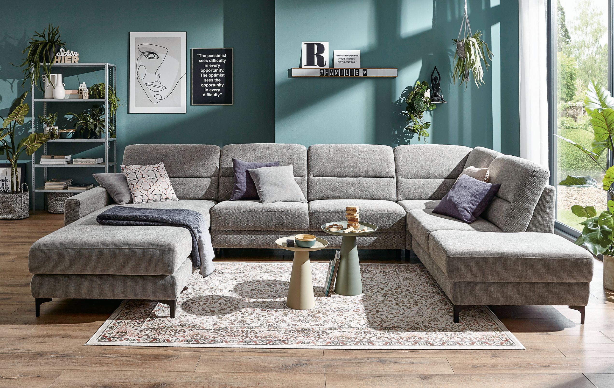 Sofa Merlos von Global Wohnen in U-Form mit grauem Stoffbezug. width=
